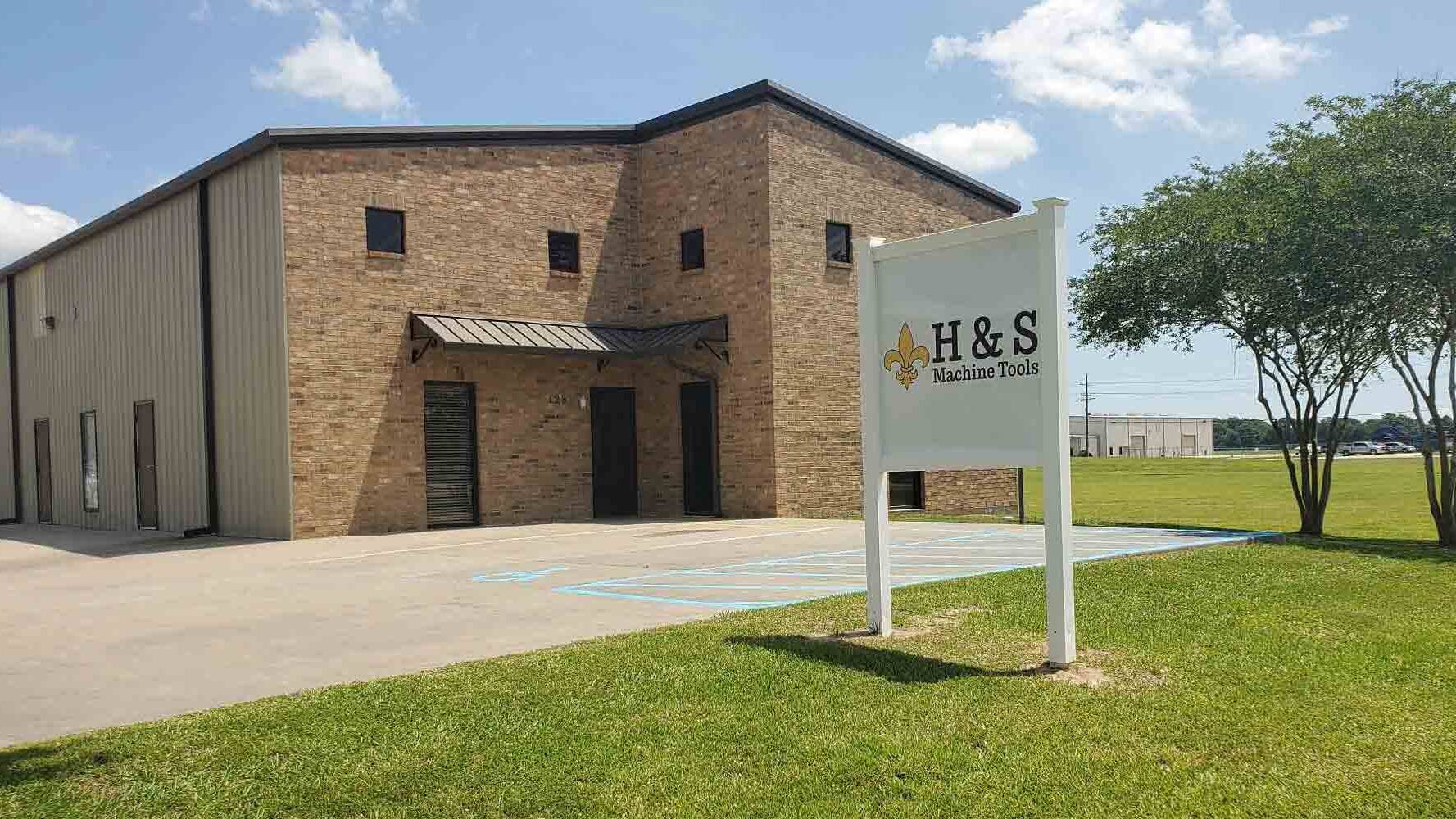 A building for H&S with a sign.