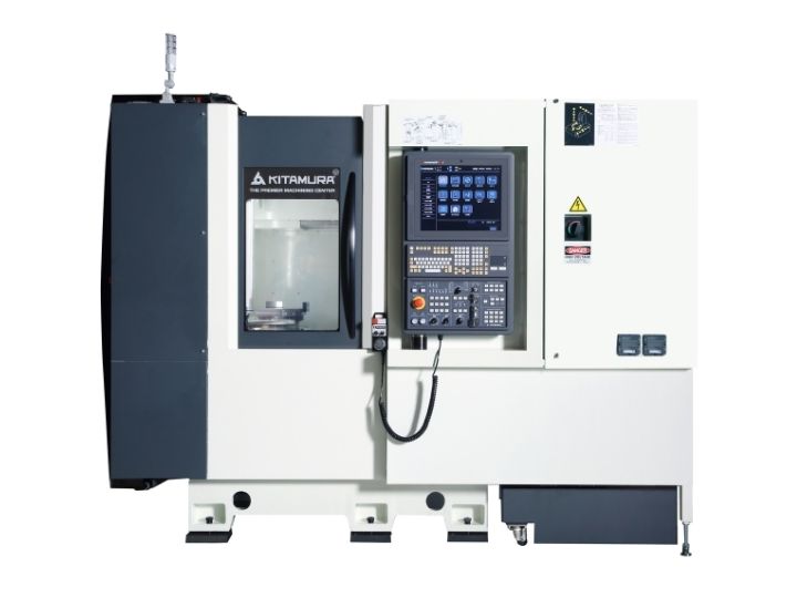 Kitamura CNC machine with an enclosed workspace and control panel.