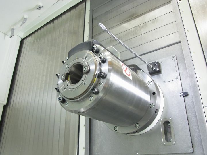 CNC machine spindle with an empty tool holder and a manual adjustment lever.
