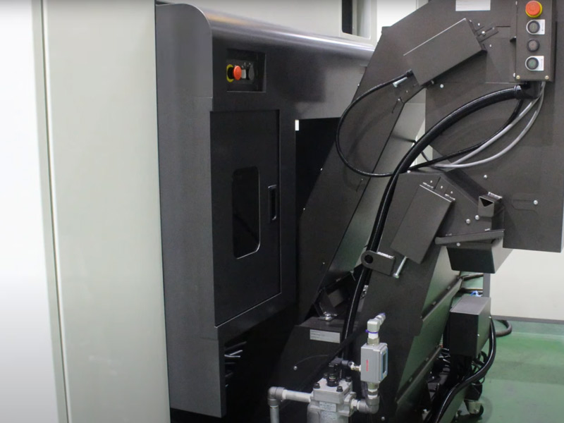 A manufacturing machine with buttons to turn it on and off.