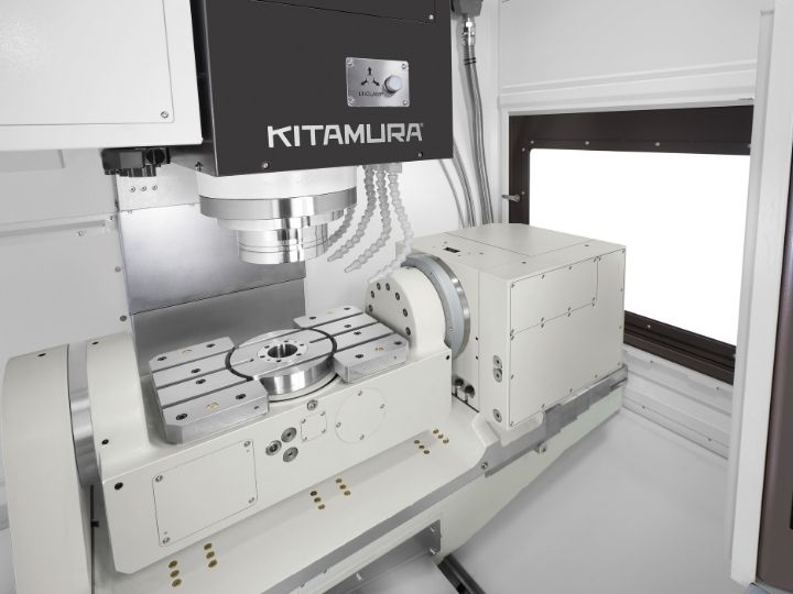 Kitamura CNC machine interior with a precision rotary table and spindle.