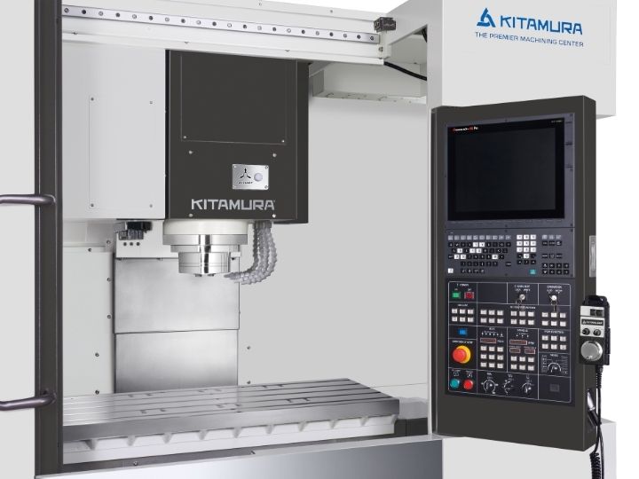 Kitamura CNC machine with a vertical spindle, metal worktable, and control panel.