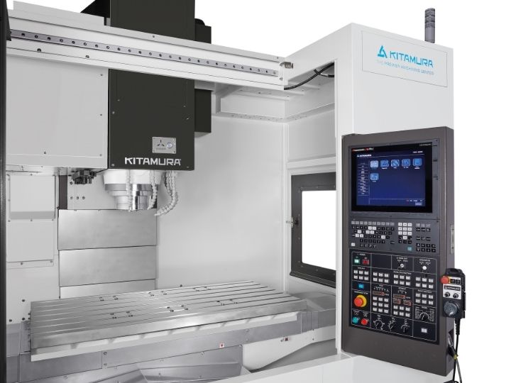 Kitamura CNC machine with a large worktable, vertical spindle, and control panel.