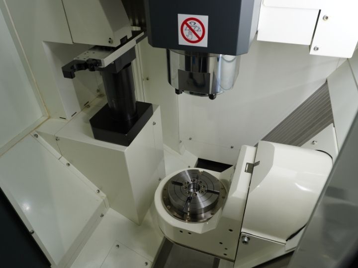 5-Axis machining system with precision spindle and rotary table for advanced manufacturing.