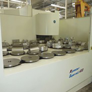 Multiple different machine parts laying on a counter.