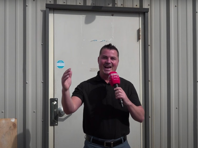 A person talking with a microphone.