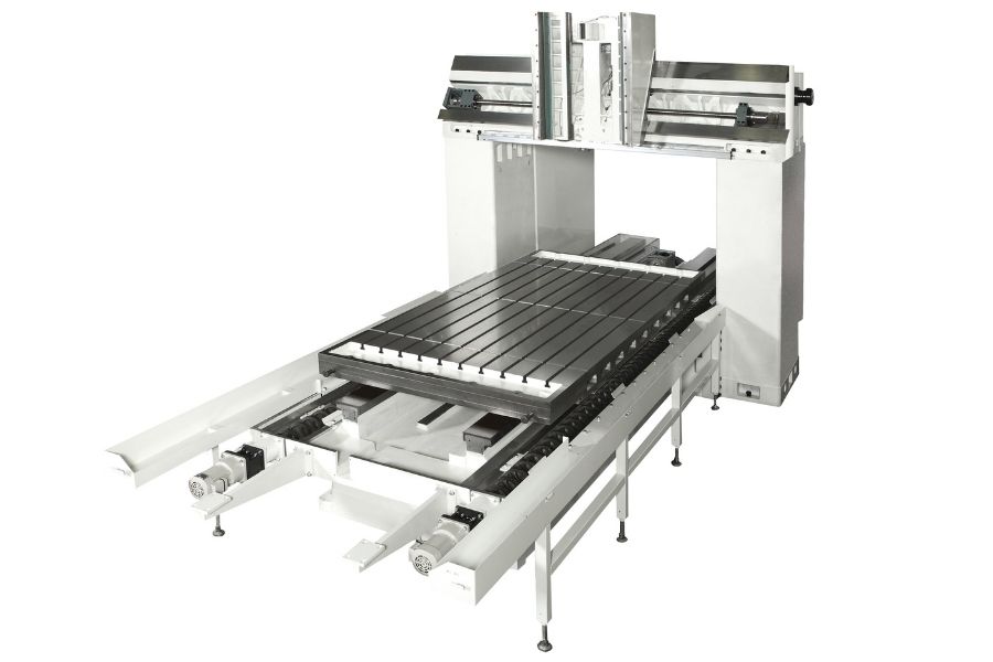 Structure of a bridge-style machining center showing the wide gantry frame, precision-ground worktable, and dual ball screw drive system for rigidity.