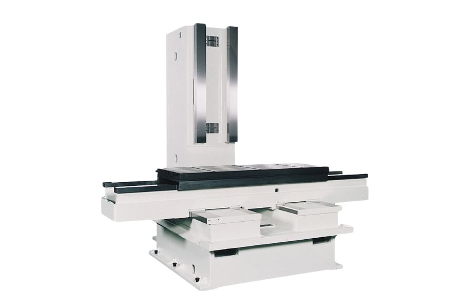 Structural base of a vertical machining center (VMC), featuring the worktable, column, and guideways for spindle and tool movement.